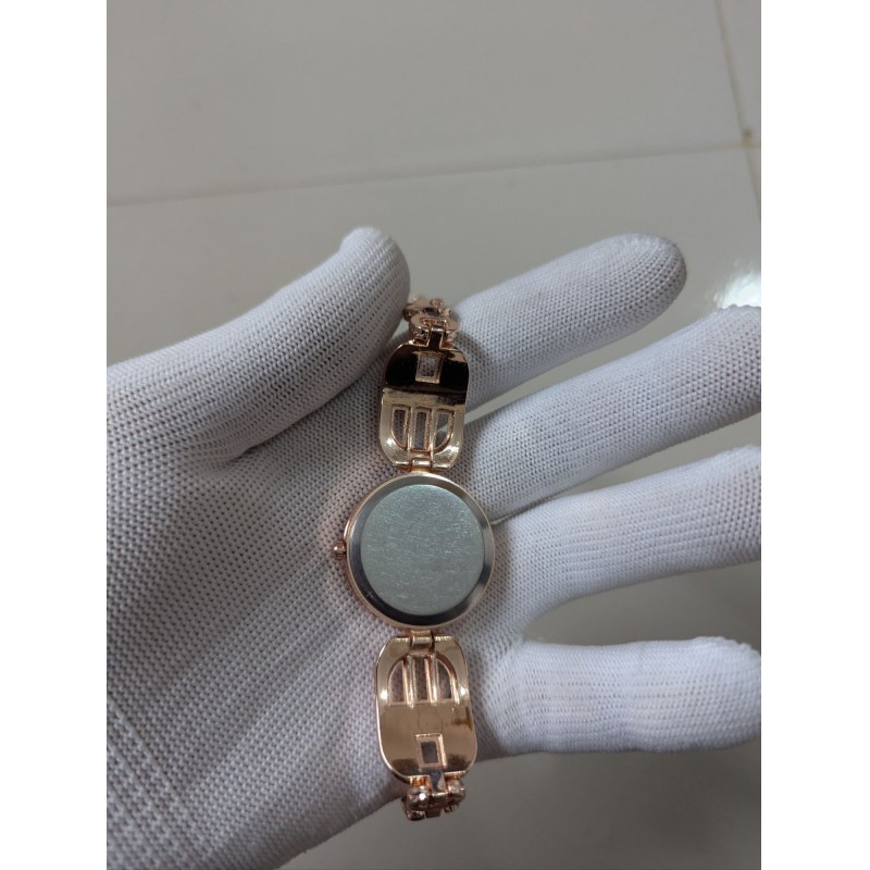 Picture of Luxury Rose Gold Women's Bracelet Watch featuring Elegant Round Dial with Crystal Bezel Blue Sapphire Baguette Gemstones Accents Premium Quartz Movement Stylish Jewelry Timepiece for Formal Occasions and Wedding Party Wear.-Multicolor
