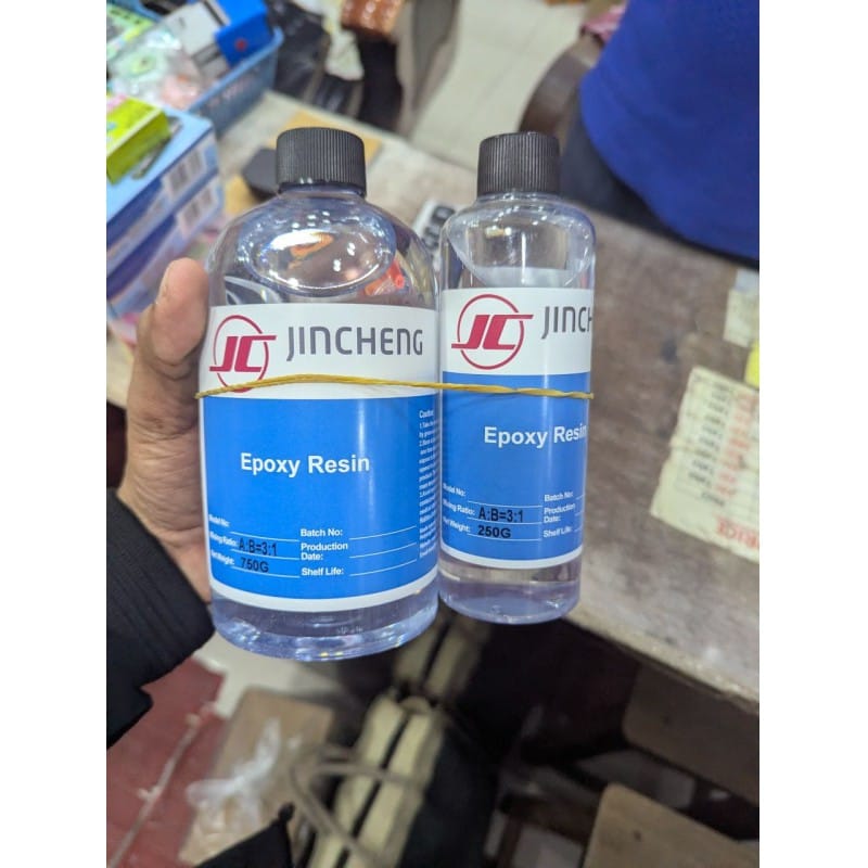 Picture of Buy JINCHENG 1kg Crystal Clear Art Epoxy Resin Kit with a precise 3:1 Mixing Ratio featuring a fast-cure formula for professional-grade jewelry making, high-gloss wood coating, and creative DIY crafts.-Multicolor