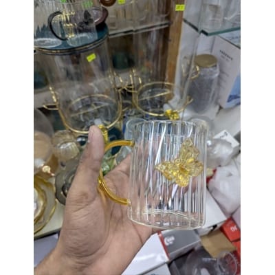 Picture of Premium High Borosilicate Glass Mug Featuring Unique 3D Amber Butterfly Design and Elegant Vertical Stripes with a Comfortable Colored Handle Perfect for Hot Tea Coffee and Stylish Home Decor Aesthetic Kitchenware.-Multicolor