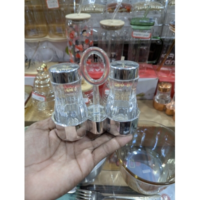 Picture of Premium Clear Acrylic Salt and Pepper Shaker Set with Chrome Finished Lids and Portable Ring Handle Stand, Elegant Transparent Condiment Dispenser Caddy for Home Kitchen Dining Table and Professional Restaurant Tableware.-Multicolor