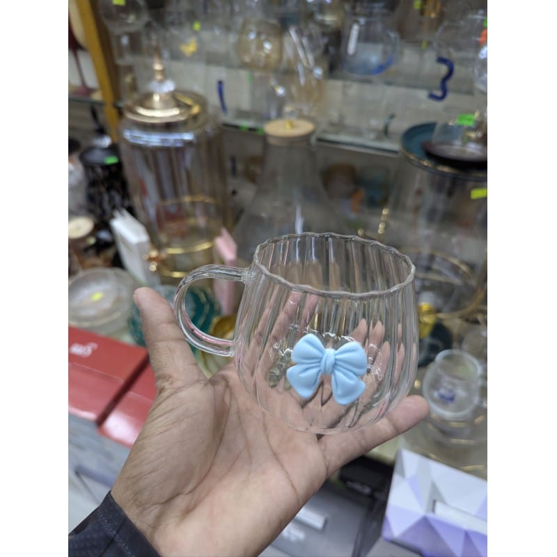 Picture of Aesthetic Japanese Style Pumpkin Shaped Glass Coffee Mug Featuring a Cute 3D Blue Bowknot Decoration Heat Resistant Borosilicate Glass Tea Cup with Large Ergonomic Handle for Elegant Home Office Beverage Service Decor.-Multicolor