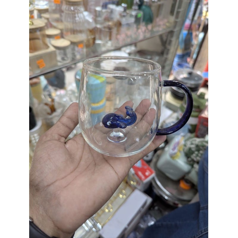Picture of Premium quality Whale Oceano glass mug featuring a handcrafted 3D blue whale figurine inside, made from durable heat resistant borosilicate glass perfect for enjoying hot coffee, tea, or cold beverages daily.-Multicolor