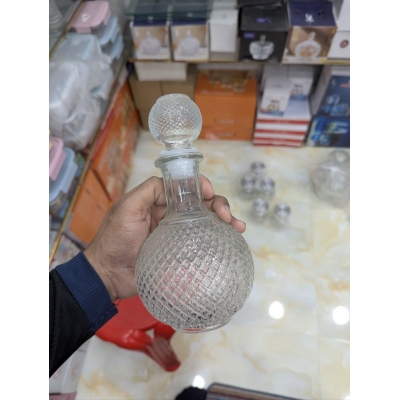 Picture of Premium Round Lead-Free Crystal Glass Whiskey Decanter with Airtight Silicone Stopper, Elegant Diamond Cut Design for Storing and Serving Bourbon, Scotch, Wine, Brandy, and Spirits in Home Bars and Special Occasions.-Multicolor