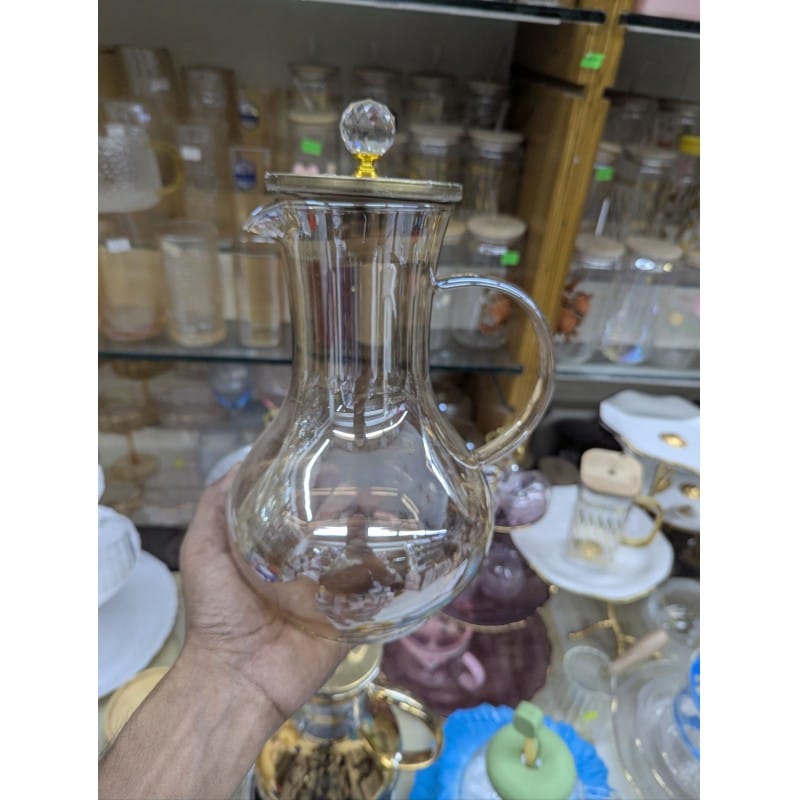 Picture of Premium Borosilicate Glass Water Pitcher with Elegant Golden Lid and Crystal Knob Top for Serving Refreshing Iced Tea Fresh Juice and Cold Beverages during Special Family Gatherings and Daily Home Dining Use.-Gold