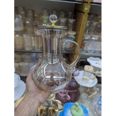 Picture of Premium Borosilicate Glass Water Pitcher with Elegant Golden Lid and Crystal Knob Top for Serving Refreshing Iced Tea Fresh Juice and Cold Beverages during Special Family Gatherings and Daily Home Dining Use.-Gold
