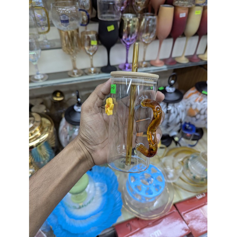 Picture of Premium High Borosilicate Square Pookie Glass Mug featuring a stylish yellow flower charm, durable bamboo lid, matching glass straw, and an ergonomic wavy amber handle for the ultimate aesthetic drinking experience today.-Multicolor