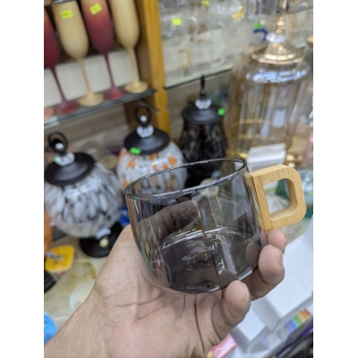 Picture of Premium Smoky Grey Borosilicate Glass Coffee Mug with Ergonomic Natural Walnut Wood Handle, Heat-Resistant Glassware Perfect for Hot Espresso, Latte, and Gourmet Tea Lovers Seeking Elegant and Minimalist Home Decor.-Black