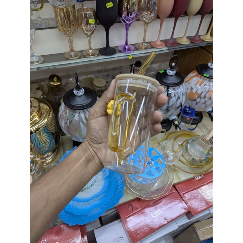 Picture of Aesthetic square glass tumbler with bamboo lid and yellow glass handle plus reusable glass straw featuring a cute flower charm perfect for iced coffee milk tea and fruit juice serving at home.-Multicolor