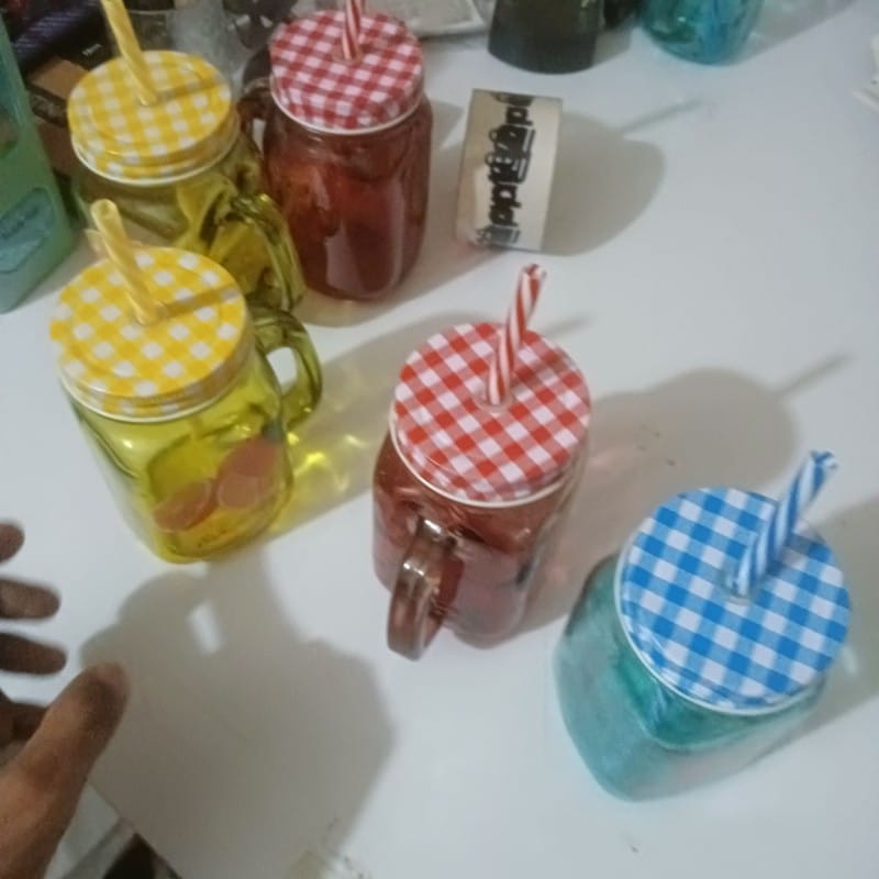 Picture of 1pcs blue glass Mason jar mug with a handle, a checkered lid, and a striped straw, designed with print print body for drinking beverages. -Blue