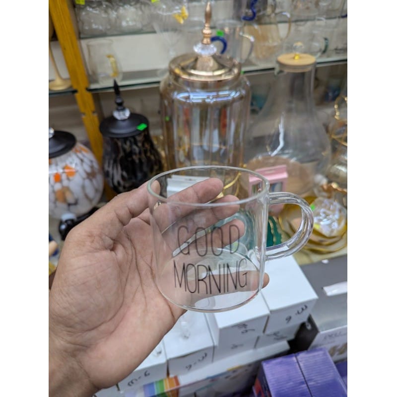 Picture of Premium Good Morning Glass Mug made from high-quality borosilicate glass, featuring a clear heat-resistant body and ergonomic handle, perfect for serving hot coffee, herbal tea, milk, or fresh fruit juice.-Multicolor