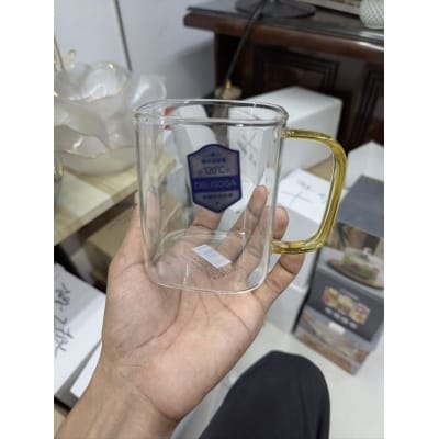 Picture of Premium Heat-Resistant Square Borosilicate Glass Mug with Ergonomic Amber Handle for Hot Tea, Coffee, and Espresso – Durable, Microwave and Dishwasher Safe Minimalist Transparent Glassware for Modern Home and Office Beverage Serving.-Multicolor