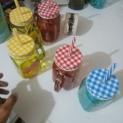 Picture of 1pcs yellow glass Mason jar mug with a handle, a checkered lid, and a striped straw, designed with print print body for drinking beverages. -Yellow