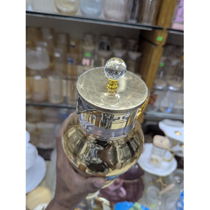 Picture of Premium Arabian Style Gold Decal Glass Pitcher with Lid for Serving Cold Water, Iced Tea, and Juice, Featuring Heat-Resistant Borosilicate Glass and Elegant Greek Key Patterns for Luxury Home Dining.-Gold