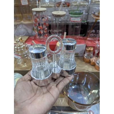Picture of Premium Clear Acrylic Salt and Pepper Shaker Set with Chrome Finished Lids and Portable Ring Handle Stand, Elegant Transparent Condiment Dispenser Caddy for Home Kitchen Dining Table and Professional Restaurant Tableware.-Multicolor