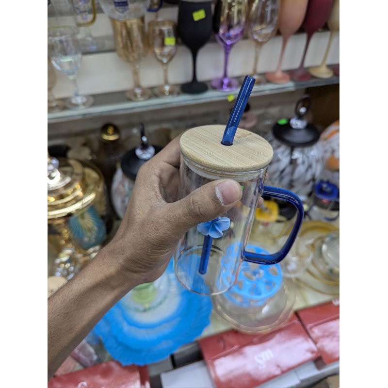 Picture of Premium Borosilicate Glass Pookie Mug with Blue Handle and Matching Glass Straw Featuring Elegant Blue Flower Charm and Eco Friendly Bamboo Lid with Airtight Silicone Seal for Hot or Cold Beverages.-Multicolor