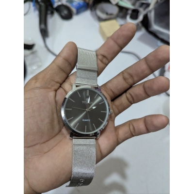 Picture of Men’s Quartz Analog Watch featuring a Premium Anthracite Dial and Stainless Steel Mesh Strap with a Slim Round Case Design perfect for Formal Business Meetings and Everyday Casual Wear for Professionals.
High-Quality Wrist Watch for Men with Durable Silve-Silver