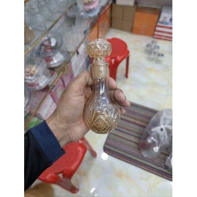 Picture of Premium Vintage Amber Crystal Glass Decanter with Diamond-Cut Base and Matching Geometric Stopper for Whiskey, Wine, or Spirits; Elegant Decorative Vessel Featuring Lead-Free Hand-Painted Gold Detailing for Luxury Home Barware Collection-Gold