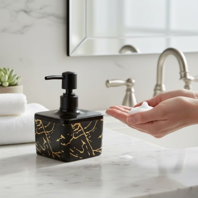 Picture of Luxury Black glass liquid soap dispenser featuring a premium gold-colored pump and decorative SOAP gold lettering perfect for enhancing your bathroom vanity decor or modern kitchen sink countertop with elegant style.-black