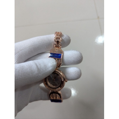 Picture of Luxury Rose Gold Women's Bracelet Watch featuring Elegant Round Dial with Crystal Bezel Blue Sapphire Baguette Gemstones Accents Premium Quartz Movement Stylish Jewelry Timepiece for Formal Occasions and Wedding Party Wear.-Multicolor