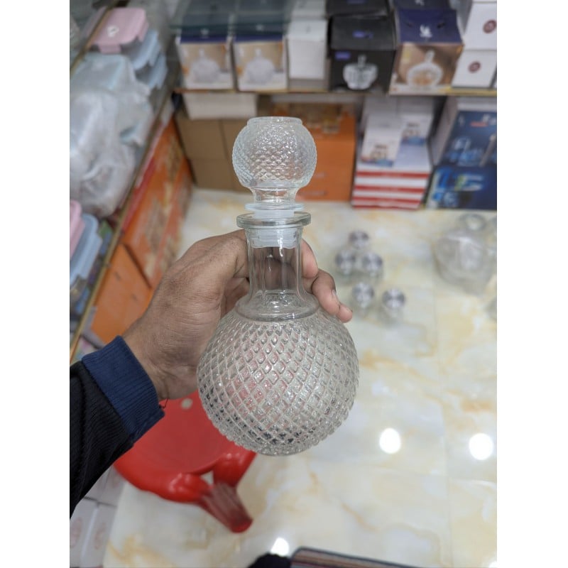 Picture of Premium Round Lead-Free Crystal Glass Whiskey Decanter with Airtight Silicone Stopper, Elegant Diamond Cut Design for Storing and Serving Bourbon, Scotch, Wine, Brandy, and Spirits in Home Bars and Special Occasions.-Multicolor
