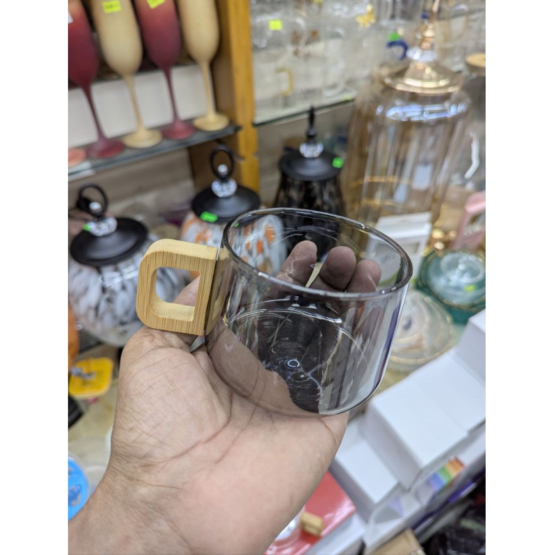 Picture of Premium Smoky Grey Borosilicate Glass Coffee Mug with Ergonomic Natural Walnut Wood Handle, Heat-Resistant Glassware Perfect for Hot Espresso, Latte, and Gourmet Tea Lovers Seeking Elegant and Minimalist Home Decor.-Black