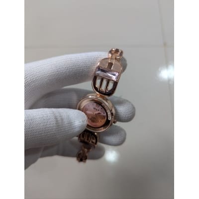 Picture of Luxury Rose Gold Bracelet Watch for Women featuring a Crystal-Studded Pink Dial with Quartz Movement, Decorative Horseshoe Links, and Premium Rhinestone Accents, Perfect for Elegant Evening Wear and Formal Gifting Occasions.-Multicolor