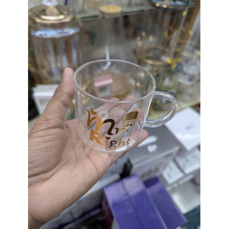 Picture of Elegant Mr. Right Transparent Glass Mug for Coffee and Tea Lovers Featuring Stylish Gold Typography with Mustache and Hat Graphics Perfect Gift for Anniversaries Weddings Birthdays and Special Couple Celebrations.-Multicolor