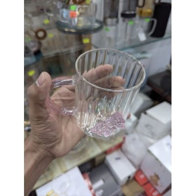 Picture of Elegant 3D butterfly high borosilicate glass mug featuring a heat resistant vertical striped fluted design and pink colored handle perfect for hot coffee herbal tea or as a charming decorative kitchen accessory.-Multicolor