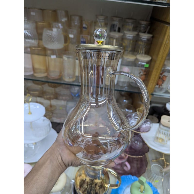 Picture of Premium Borosilicate Glass Water Pitcher with Elegant Golden Lid and Crystal Knob Top for Serving Refreshing Iced Tea Fresh Juice and Cold Beverages during Special Family Gatherings and Daily Home Dining Use.-Gold