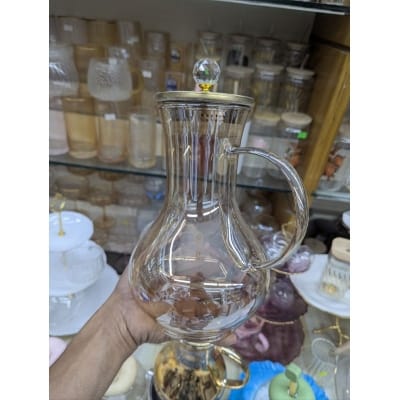 Picture of Premium Borosilicate Glass Water Pitcher with Elegant Golden Lid and Crystal Knob Top for Serving Refreshing Iced Tea Fresh Juice and Cold Beverages during Special Family Gatherings and Daily Home Dining Use.-Gold