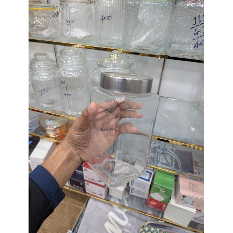 Picture of High-quality square glass storage jar with airtight stainless steel metal lid for kitchen pantry organization of dry food items like snacks pulses spices grains and coffee beans for fresh long-lasting storage.-Multicolor