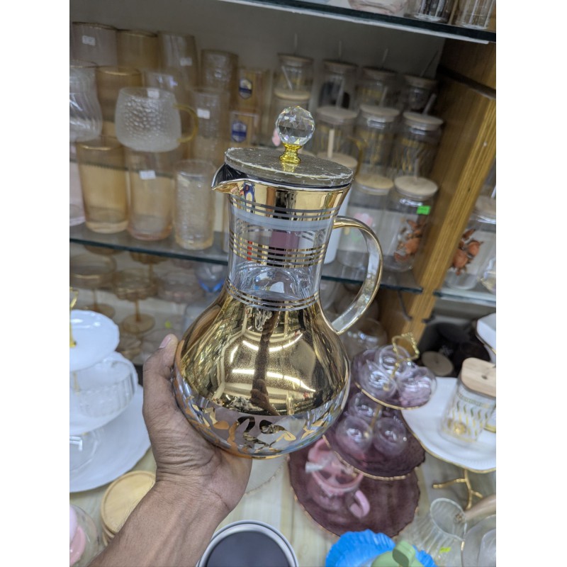 Picture of Premium luxury golden glass jug for dining table stylish 1700ml capacity heat resistant borosilicate glass water pitcher with lid and crystal knob perfect for serving cold juice tea and beverage items.-Gold