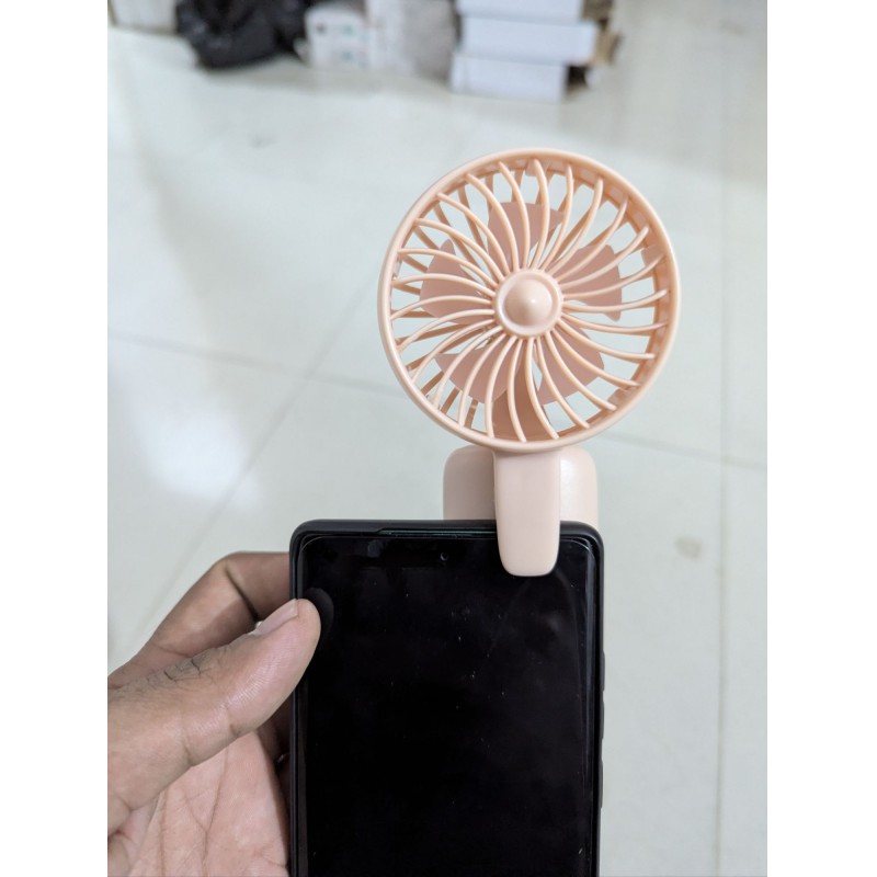Picture of Portable USB rechargeable mini handheld fan for mobile phones and laptops featuring a compact design quiet operation three adjustable speed modes and a stable clip for hands-free cooling during travel or work.-Multicolor