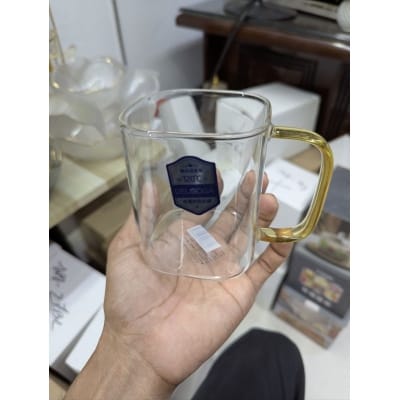 Picture of Premium Heat-Resistant Square Borosilicate Glass Mug with Ergonomic Amber Handle for Hot Tea, Coffee, and Espresso – Durable, Microwave and Dishwasher Safe Minimalist Transparent Glassware for Modern Home and Office Beverage Serving.-Multicolor