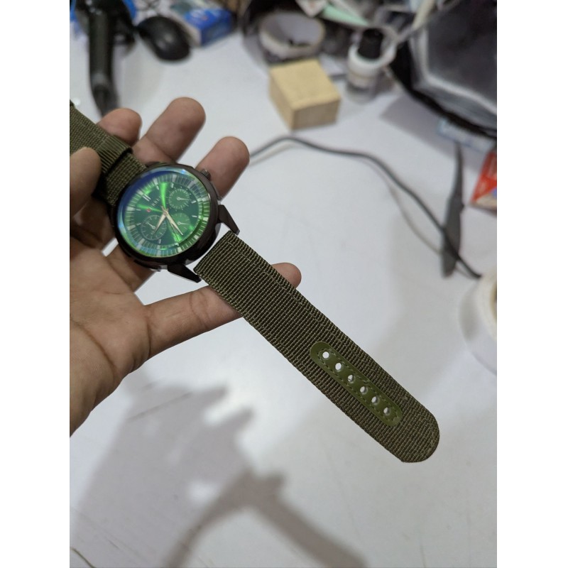 Picture of Men's Sports Analog Quartz Watch featuring a Stylish Green Dial and Durable Olive Green Nylon Fabric Strap, Perfect for Casual Wear and Outdoor Activities for Fashionable Men in Bangladesh Today.-Green