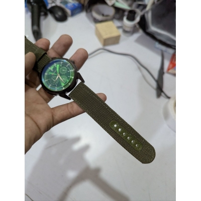 Picture of Men's Sports Analog Quartz Watch featuring a Stylish Green Dial and Durable Olive Green Nylon Fabric Strap, Perfect for Casual Wear and Outdoor Activities for Fashionable Men in Bangladesh Today.-Green