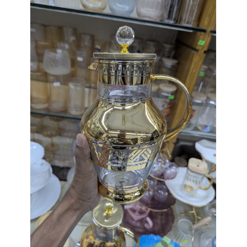 Picture of Premium Arabian Style Gold Decal Glass Pitcher with Lid for Serving Cold Water, Iced Tea, and Juice, Featuring Heat-Resistant Borosilicate Glass and Elegant Greek Key Patterns for Luxury Home Dining.-Gold