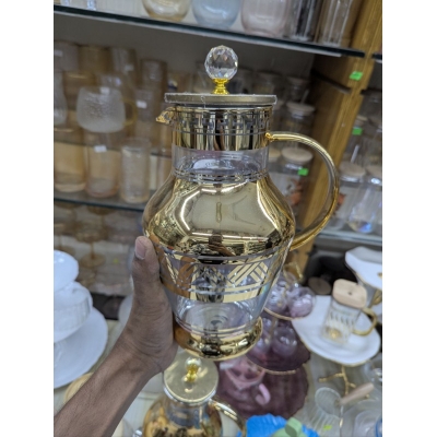 Picture of Premium Arabian Style Gold Decal Glass Pitcher with Lid for Serving Cold Water, Iced Tea, and Juice, Featuring Heat-Resistant Borosilicate Glass and Elegant Greek Key Patterns for Luxury Home Dining.-Gold