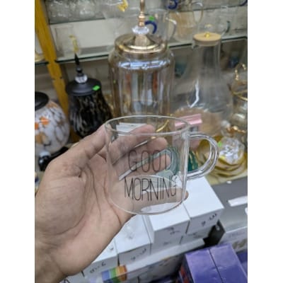 Picture of Premium Good Morning Glass Mug made from high-quality borosilicate glass, featuring a clear heat-resistant body and ergonomic handle, perfect for serving hot coffee, herbal tea, milk, or fresh fruit juice.-Multicolor