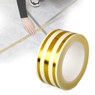 Picture of 5M Golden Tile Gap Tape, Home Tile Sticker Waterproof Tape PVC Self Adhesive Tape Ceramic Tile Gap Tape for Detailing Wall, Floor Tile Gap, Cabinetry (2.5CM*5M)-Gold