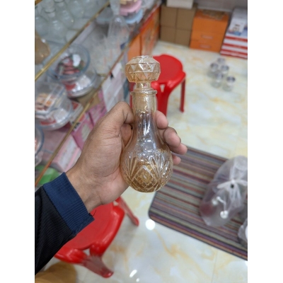 Picture of Premium Vintage Amber Crystal Glass Decanter with Diamond-Cut Base and Matching Geometric Stopper for Whiskey, Wine, or Spirits; Elegant Decorative Vessel Featuring Lead-Free Hand-Painted Gold Detailing for Luxury Home Barware Collection-Gold
