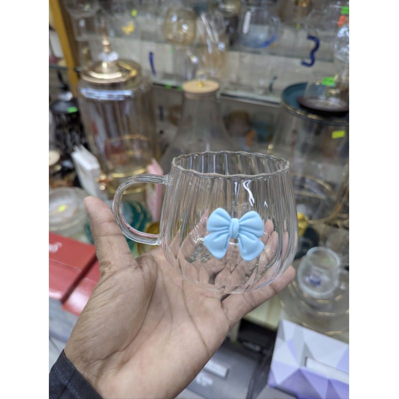 Picture of Aesthetic Japanese Style Pumpkin Shaped Glass Coffee Mug Featuring a Cute 3D Blue Bowknot Decoration Heat Resistant Borosilicate Glass Tea Cup with Large Ergonomic Handle for Elegant Home Office Beverage Service Decor.-Multicolor