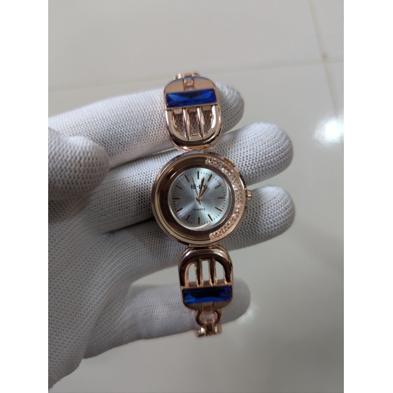 Picture of Luxury Rose Gold Women's Bracelet Watch featuring Elegant Round Dial with Crystal Bezel Blue Sapphire Baguette Gemstones Accents Premium Quartz Movement Stylish Jewelry Timepiece for Formal Occasions and Wedding Party Wear.-Multicolor