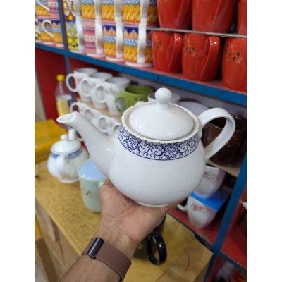 Picture of Elegant White Porcelain Teapot Featuring Intricate Navy Blue Floral Pattern for Premium Afternoon Tea Service Experiences.-Multicolor