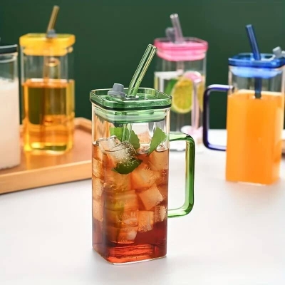 Picture of Borosilicate Glass 400ml Clear Cup with Multicolor Handle, Acrylic Lid, and Straw – Ideal for Coffee, Milk, Juice – Microwave Safe, Scratch Resistant – 1PCS.-yellow