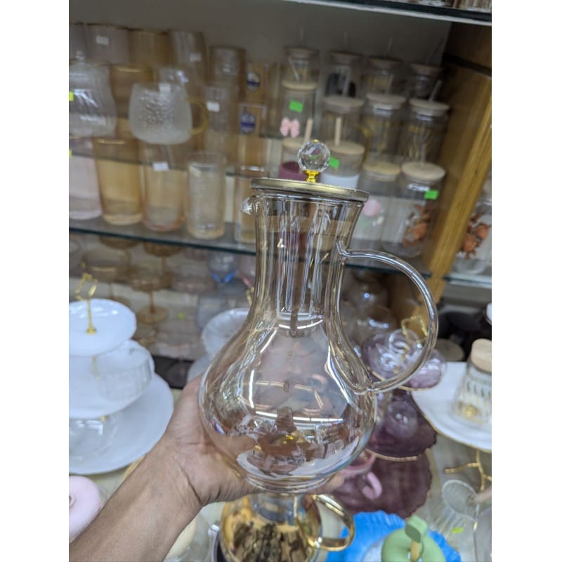 Picture of Premium Borosilicate Glass Water Pitcher with Elegant Golden Lid and Crystal Knob Top for Serving Refreshing Iced Tea Fresh Juice and Cold Beverages during Special Family Gatherings and Daily Home Dining Use.-Gold
