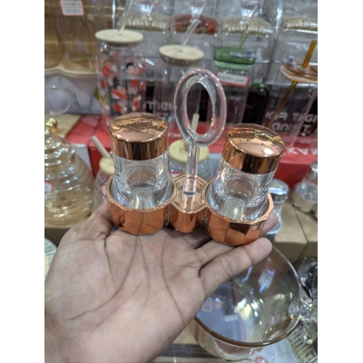 Picture of Premium Quality Glass Salt and Pepper Shaker Set with Stylish Metal Carrying Stand, Ideal Kitchen Condiment Dispenser and Dining Table Spice Container Perfect for Home Use, Restaurants, and Elegant Tabletop Organization.-Multicolor