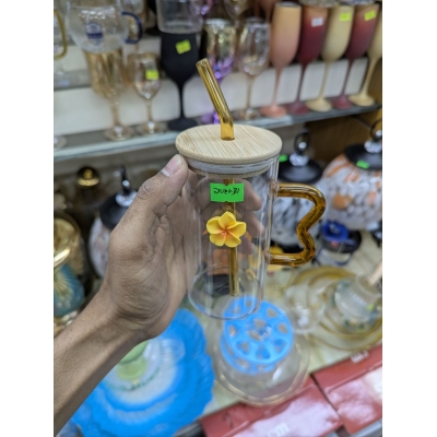 Picture of Premium High Borosilicate Square Pookie Glass Mug featuring a stylish yellow flower charm, durable bamboo lid, matching glass straw, and an ergonomic wavy amber handle for the ultimate aesthetic drinking experience today.-Multicolor