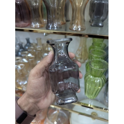Picture of Elegant Moira clear glass hand-tied flower vase with bulbous body and flared rim, perfect for wedding centerpieces, minimalist home decor, or displaying beautiful fresh floral arrangements and small aesthetic flower bouquets.-Multicolor