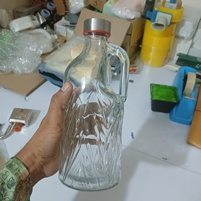 Picture of Stay refreshed: 1-liter transparent glass water bottle with airtight stainless steel cap for water, juice, and daily use – perfect for travel, gym, and home.-Multicolor
